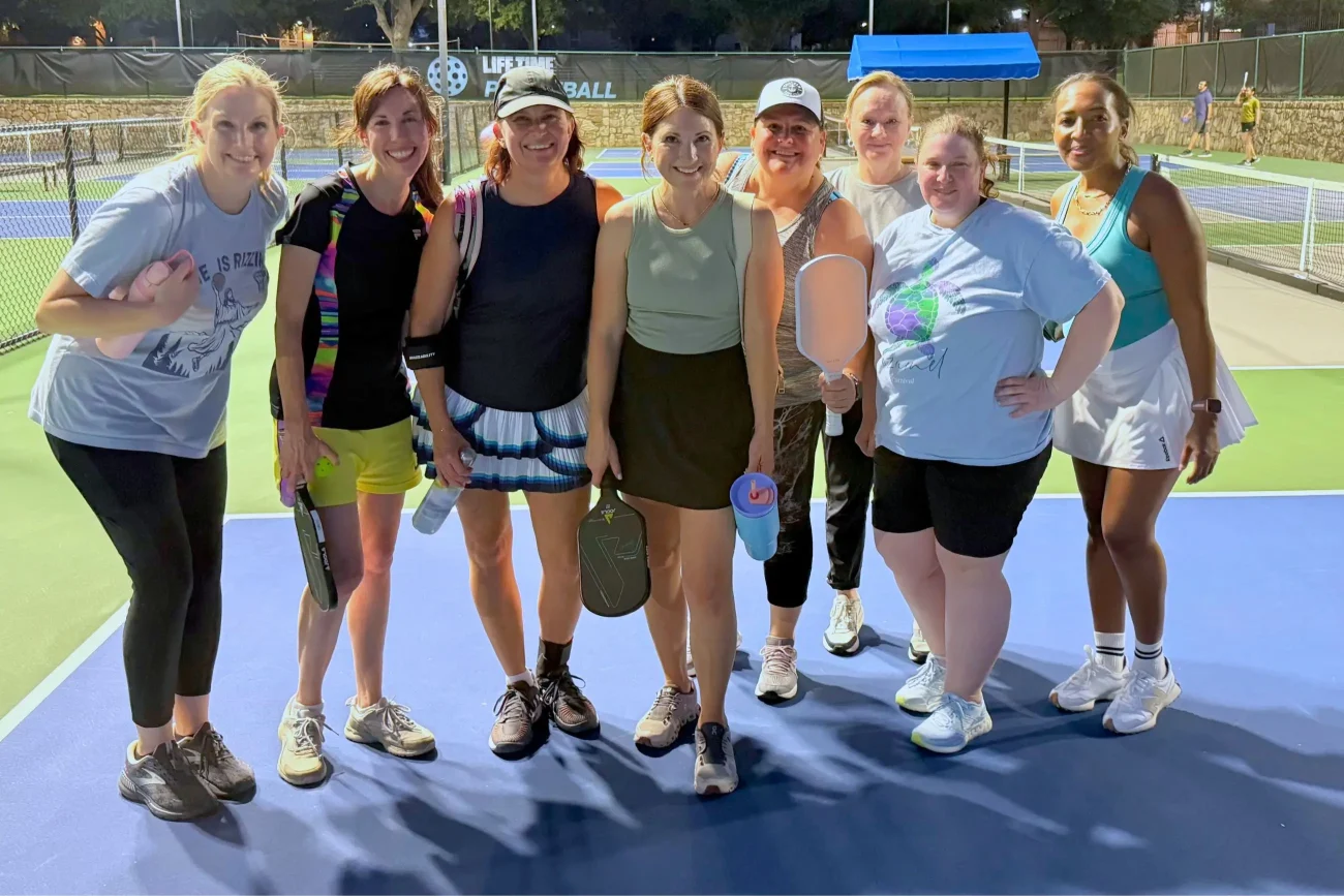 Group of single women playing pickleball