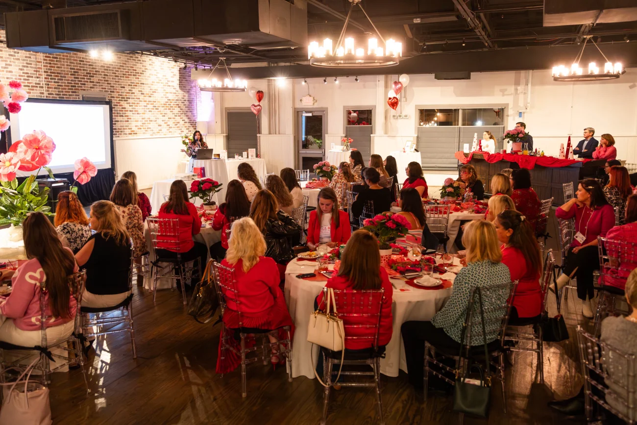 Galentine's 26 with women listening to speaker